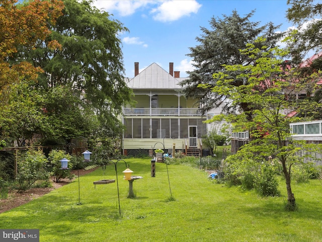 214 Center St, Edinburg, VA 22824 - back of property featuring a sunroom, a chimney, a lawn, and a balcony