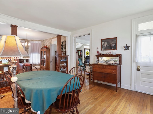 214 Center St, Edinburg, VA 22824 - dining space featuring a chandelier, healthy amount of natural light, wood-type flooring, and baseboards