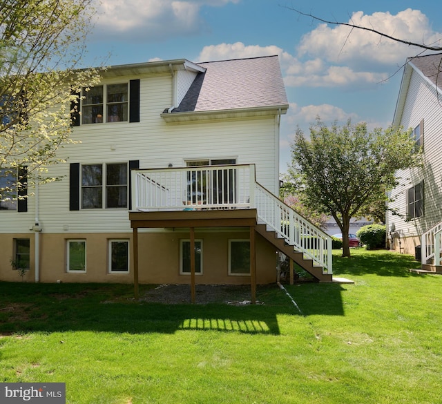121 Washington Pl, State College, PA 16801 - back of property with stairway, a lawn, a wooden deck, and a shingled roof