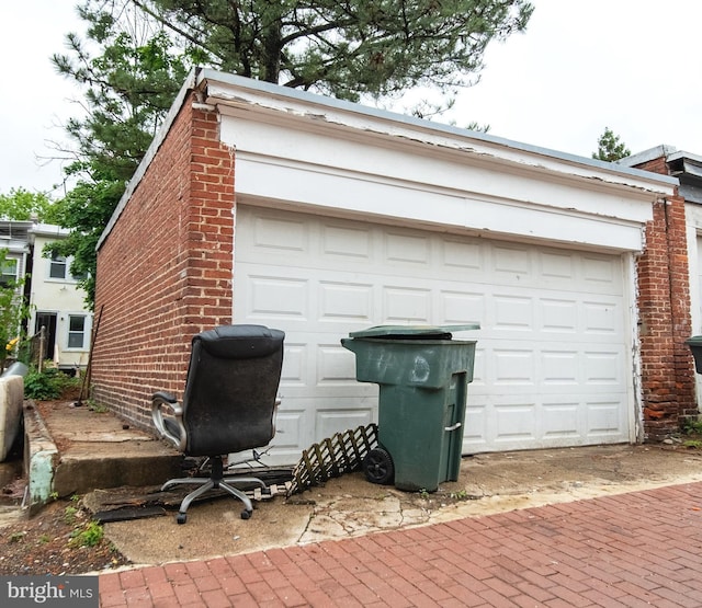 garage featuring decorative driveway