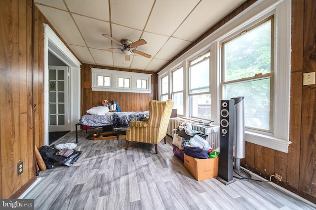 sunroom / solarium with plenty of natural light and radiator