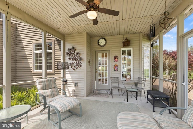 sunroom with a ceiling fan