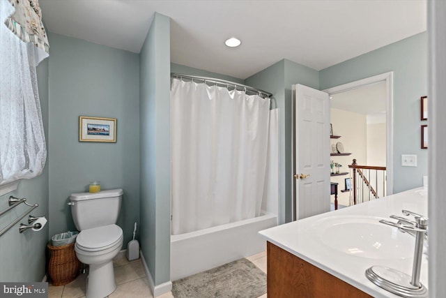 bathroom featuring toilet, tile patterned floors, vanity, and shower / bath combo