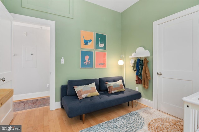 sitting room with wood finished floors and baseboards