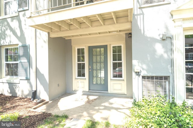 8318 Kingsgate Rd Unit 537, Springfield, VA 22152 - view of exterior entry featuring stucco siding and a balcony