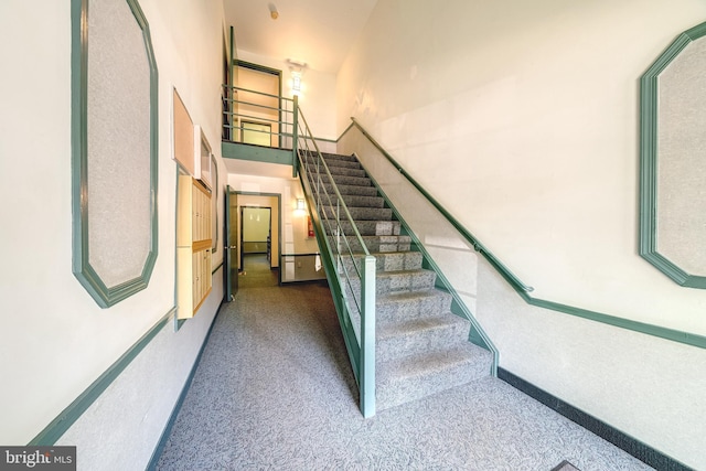 8318 Kingsgate Rd Unit 537, Springfield, VA 22152 - staircase featuring a towering ceiling and carpet floors