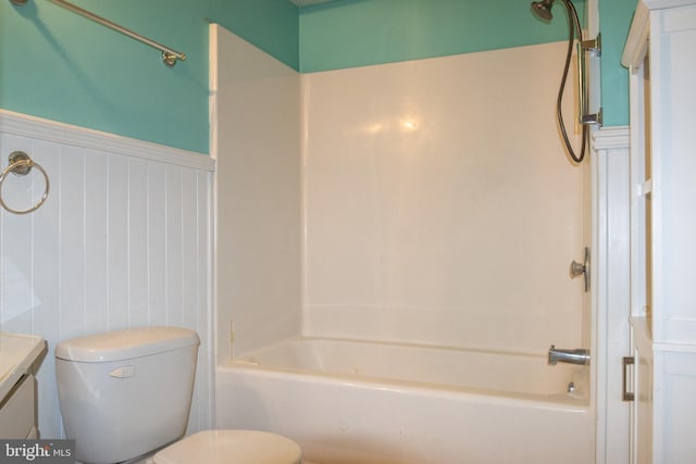 1158 Custer Dr, Auburn, PA 17922 - full bathroom featuring wainscoting, vanity, washtub / shower combination, and toilet