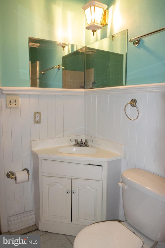1158 Custer Dr, Auburn, PA 17922 - bathroom featuring toilet, vanity, and a wainscoted wall
