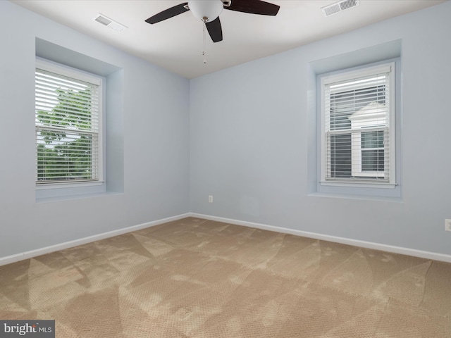 9411 Zebedee St, Manassas, VA 20110 - empty room featuring light colored carpet, a ceiling fan, and baseboards