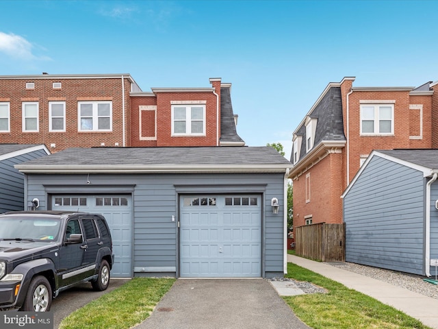 9411 Zebedee St, Manassas, VA 20110 - view of front of home with driveway and a garage