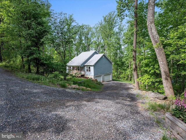 433 Tulip Poplar Dr, Linden, VA 22642 - view of side of home featuring gravel driveway and an attached garage