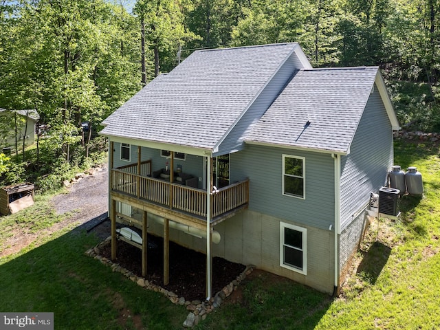 433 Tulip Poplar Dr, Linden, VA 22642 - back of house with a shingled roof, central AC unit, a lawn, and a deck