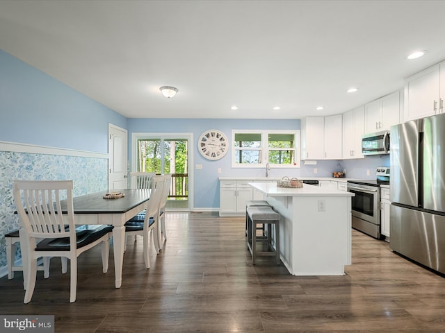 433 Tulip Poplar Dr, Linden, VA 22642 - kitchen with stainless steel appliances, a kitchen island, plenty of natural light, recessed lighting, and white cabinetry