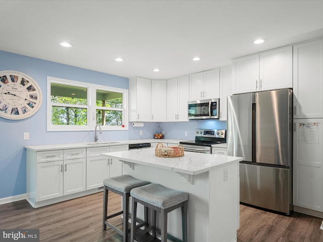 433 Tulip Poplar Dr, Linden, VA 22642 - kitchen featuring stainless steel appliances, white cabinetry, a sink, wood finished floors, and recessed lighting