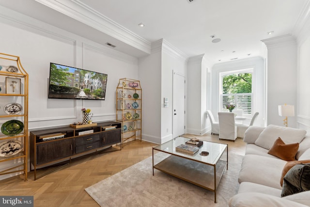 living room with ornamental molding, baseboards, and recessed lighting