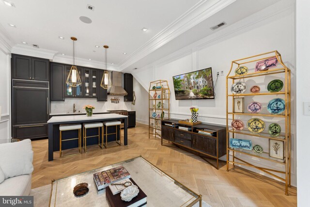 living room with ornamental molding, recessed lighting, and baseboards
