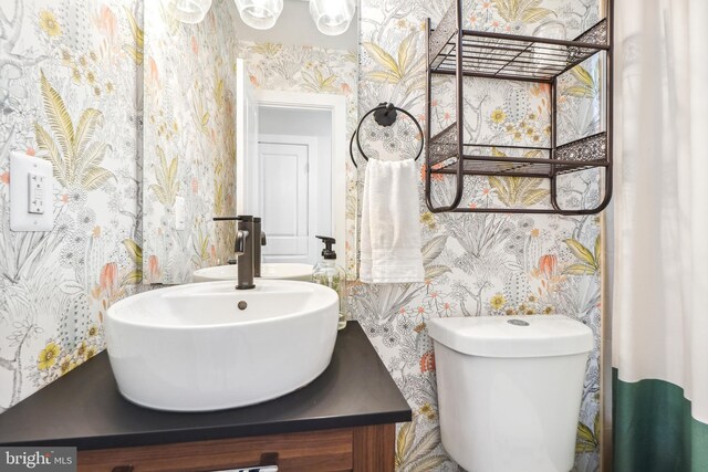 528 Kennedy St NW Unit 502, Washington, DC 20011 - bathroom with wallpapered walls, vanity, and toilet