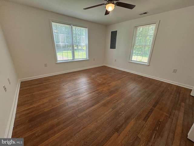 8888 Harmony Rd, Denton, MD 21629 - spare room featuring healthy amount of natural light, dark wood-style flooring, a ceiling fan, and electric panel