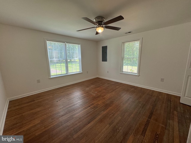 8888 Harmony Rd, Denton, MD 21629 - spare room featuring dark wood-style flooring, ceiling fan, baseboards, and electric panel