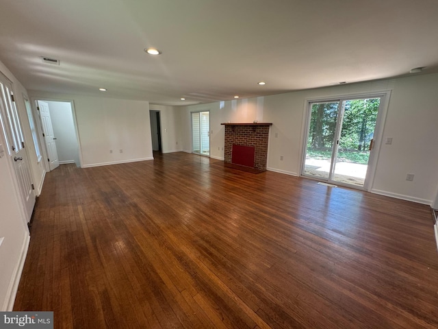8888 Harmony Rd, Denton, MD 21629 - unfurnished living room with dark wood-type flooring, recessed lighting, a fireplace, and baseboards