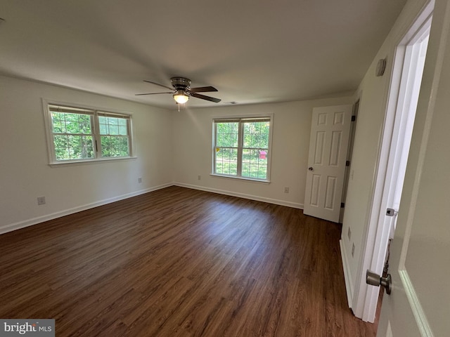 8888 Harmony Rd, Denton, MD 21629 - empty room with dark wood-style flooring, a ceiling fan, and baseboards