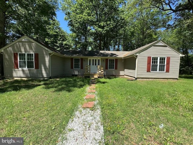 8888 Harmony Rd, Denton, MD 21629 - ranch-style home featuring a front lawn