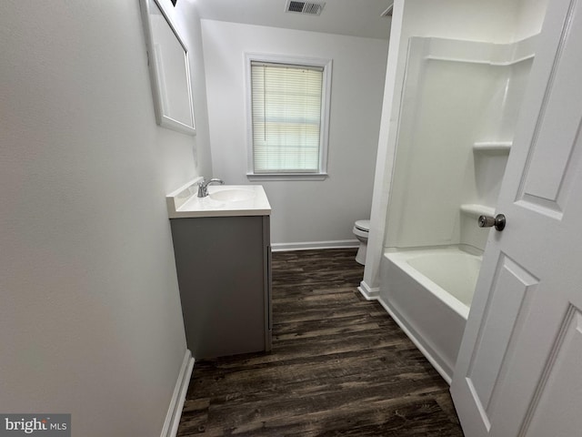 8888 Harmony Rd, Denton, MD 21629 - bathroom featuring wood finished floors, baseboards, toilet, and vanity