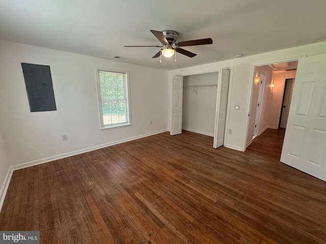 8888 Harmony Rd, Denton, MD 21629 - unfurnished bedroom featuring electric panel, dark wood finished floors, and baseboards
