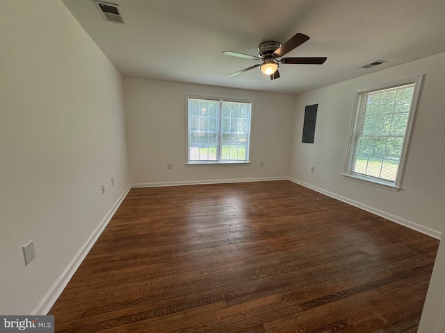 8888 Harmony Rd, Denton, MD 21629 - empty room with a ceiling fan, dark wood finished floors, baseboards, and electric panel