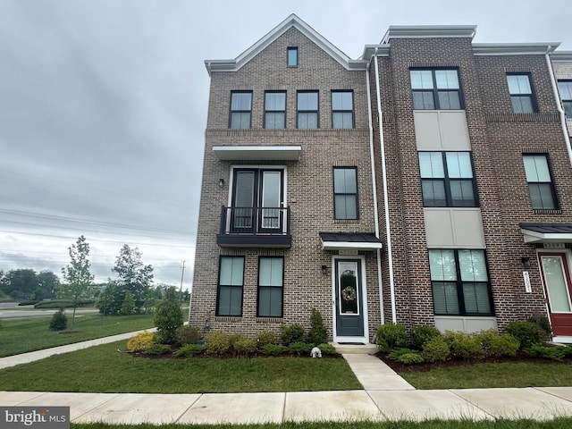 42089 Shining Star Sq, Brambleton, VA 20148 - multi unit property featuring brick siding and a front lawn