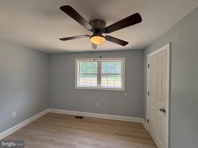 581 Milford Neck Rd, Milford, DE 19963 - empty room with ceiling fan, light wood-style flooring, and baseboards