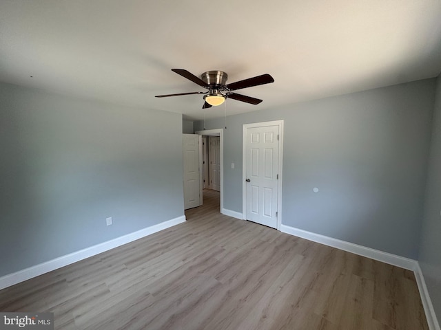 581 Milford Neck Rd, Milford, DE 19963 - unfurnished room featuring baseboards, wood finished floors, and a ceiling fan