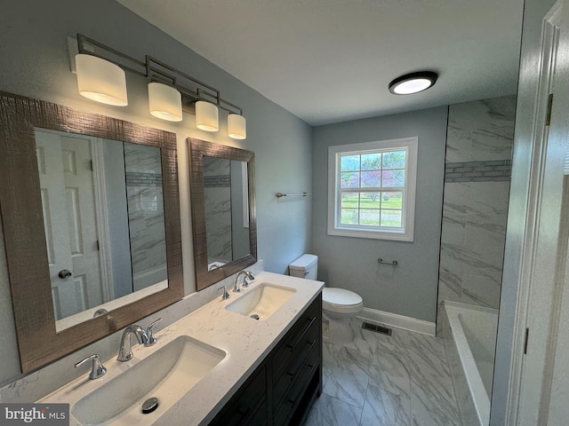 581 Milford Neck Rd, Milford, DE 19963 - bathroom featuring marble finish floors, toilet, a tub, baseboards, and double vanity