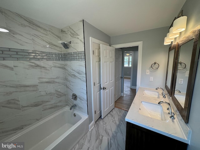 581 Milford Neck Rd, Milford, DE 19963 - bathroom featuring bathtub / shower combination, marble finish flooring, double vanity, and baseboards