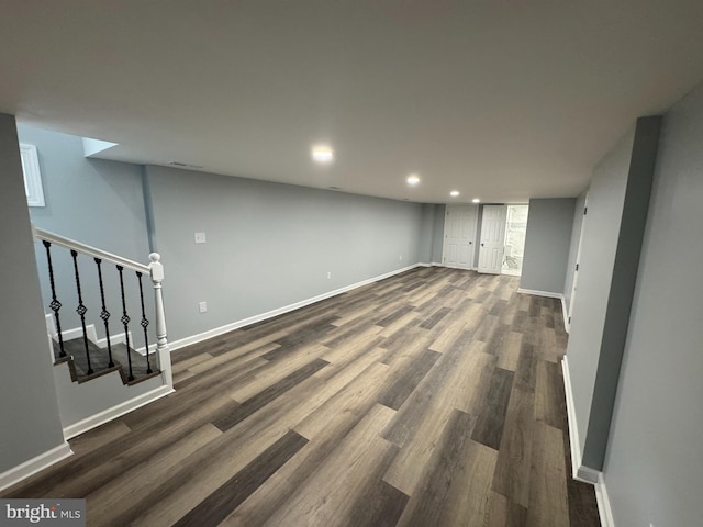 581 Milford Neck Rd, Milford, DE 19963 - basement with baseboards, dark wood-style flooring, recessed lighting, and stairs