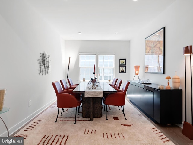 dining space featuring baseboards