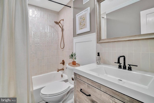 bathroom featuring toilet, decorative backsplash, shower / bath combo, vanity, and tile walls
