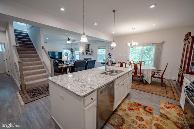 8212 Hickory Hollow Dr, Glen Burnie, MD 21060 - kitchen with stainless steel dishwasher, a sink, wood finished floors, white cabinets, and recessed lighting