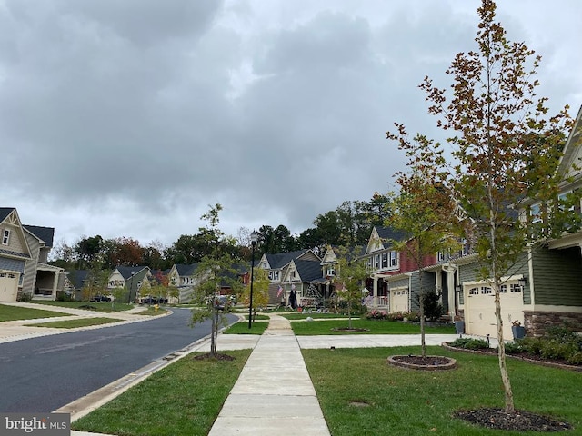8212 Hickory Hollow Dr, Glen Burnie, MD 21060 - view of asphalt road with a residential view and sidewalks
