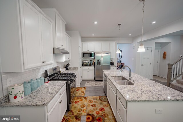 8212 Hickory Hollow Dr, Glen Burnie, MD 21060 - kitchen with stainless steel appliances, a sink, under cabinet range hood, white cabinetry, and recessed lighting