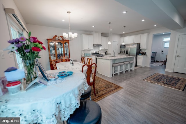 8212 Hickory Hollow Dr, Glen Burnie, MD 21060 - dining room featuring recessed lighting, a chandelier, dark wood-style floors, and baseboards