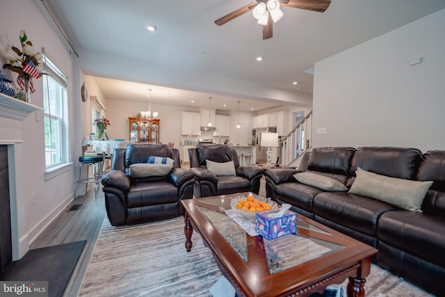 8212 Hickory Hollow Dr, Glen Burnie, MD 21060 - living room featuring a ceiling fan, light wood-style flooring, a chandelier, recessed lighting, and baseboards