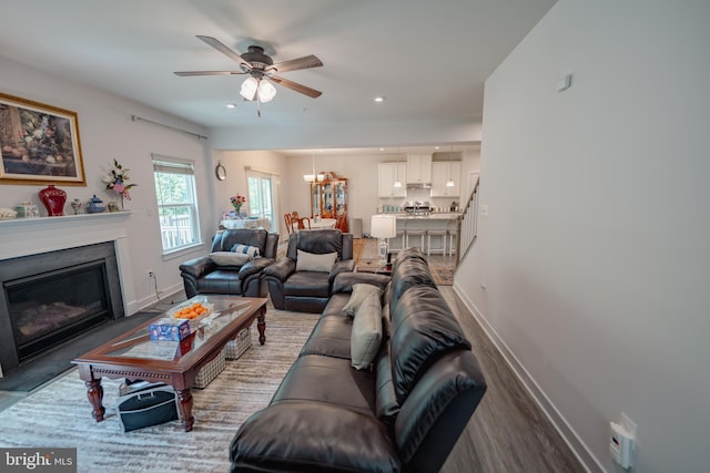 8212 Hickory Hollow Dr, Glen Burnie, MD 21060 - living room featuring baseboards, a ceiling fan, a glass covered fireplace, recessed lighting, and wood finished floors