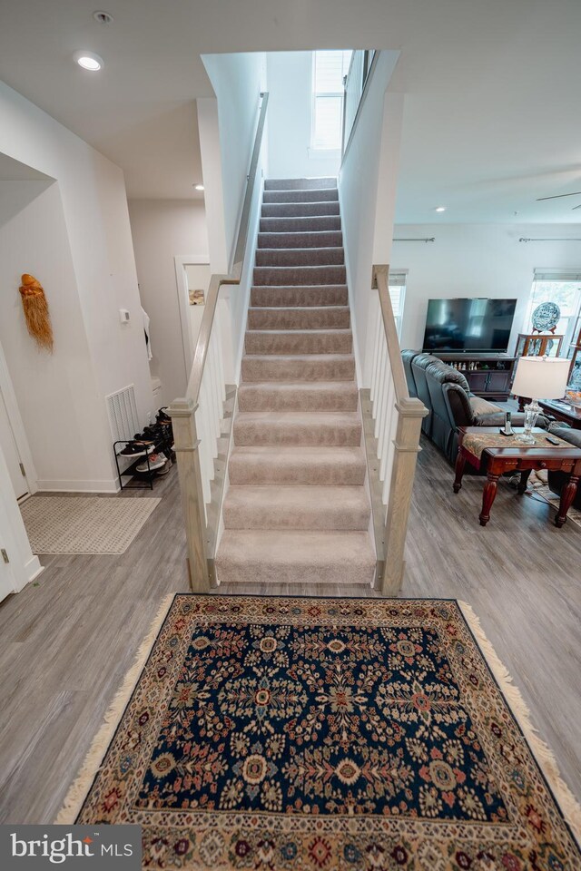 8212 Hickory Hollow Dr, Glen Burnie, MD 21060 - staircase featuring wood finished floors and baseboards