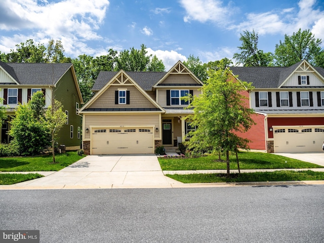 8212 Hickory Hollow Dr, Glen Burnie, MD 21060 - craftsman-style home featuring driveway, a front yard, stone siding, and board and batten siding