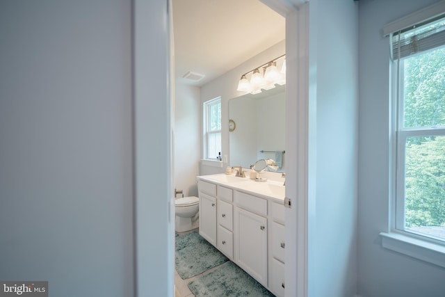 8212 Hickory Hollow Dr, Glen Burnie, MD 21060 - bathroom featuring toilet, vanity, and tile patterned floors