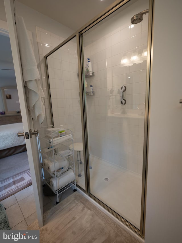 8212 Hickory Hollow Dr, Glen Burnie, MD 21060 - bathroom featuring a shower stall, ensuite bath, and tile patterned floors
