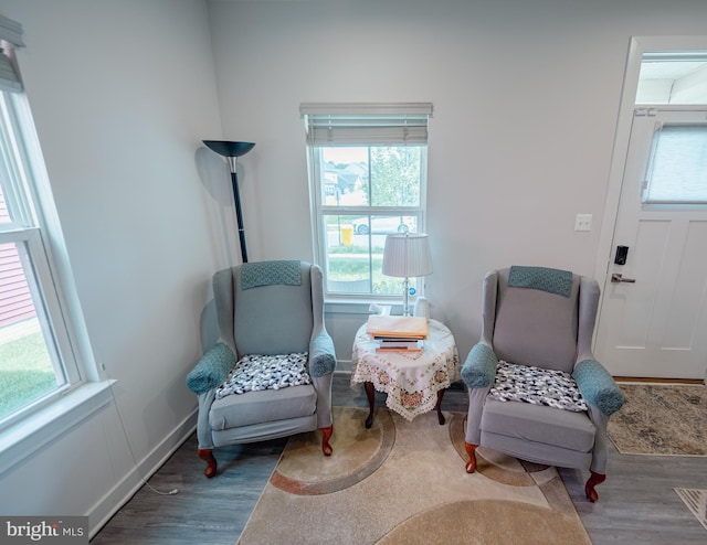 8212 Hickory Hollow Dr, Glen Burnie, MD 21060 - living area featuring wood finished floors, healthy amount of natural light, and baseboards