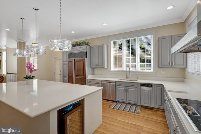 kitchen featuring dishwasher, gray cabinetry, beverage cooler, a sink, and paneled built in refrigerator