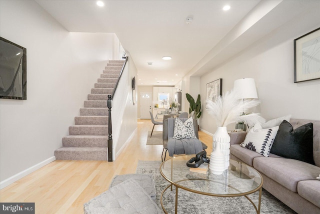 1413 E Lafayette Ave, Baltimore, MD 21213 - living area with stairs, light wood finished floors, baseboards, and recessed lighting